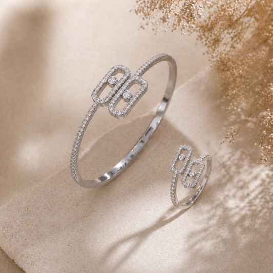 Elegant smykkesett med runde detaljer – armbånd og øredobber med zirkonia